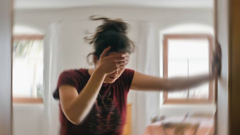 photo of a woman suffering from dizziness
